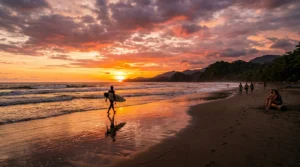 Surfer_walking_on_beach_sunset