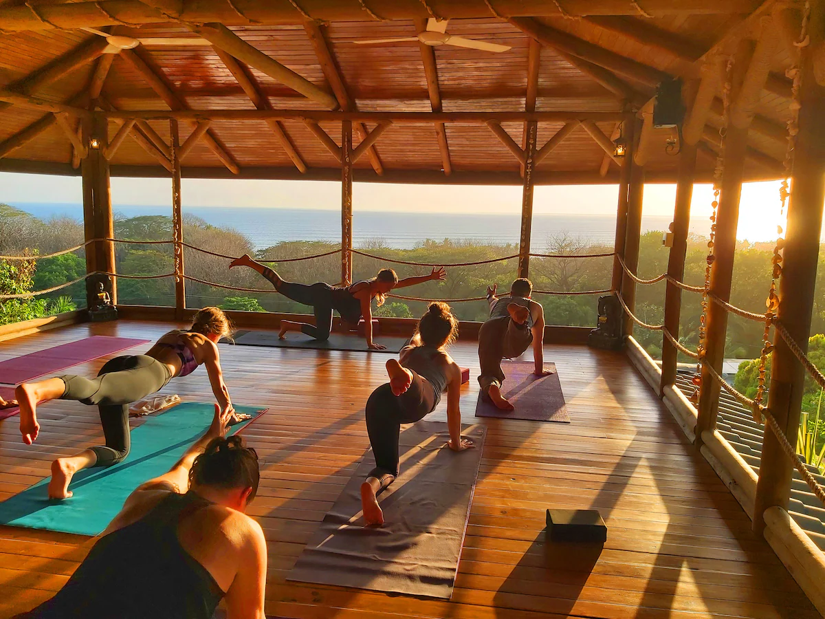 Open air yoga deck overlooking the ocean for a Nosara Costa Rica yoga surf retreat