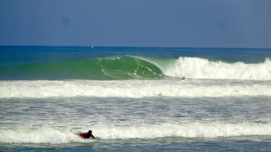 Intermediate surfer pulling into a punchy wave while surfing santa teresa costa rica