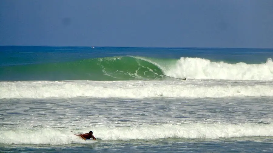 Intermediate surfer pulling into a punchy wave while surfing santa teresa costa rica