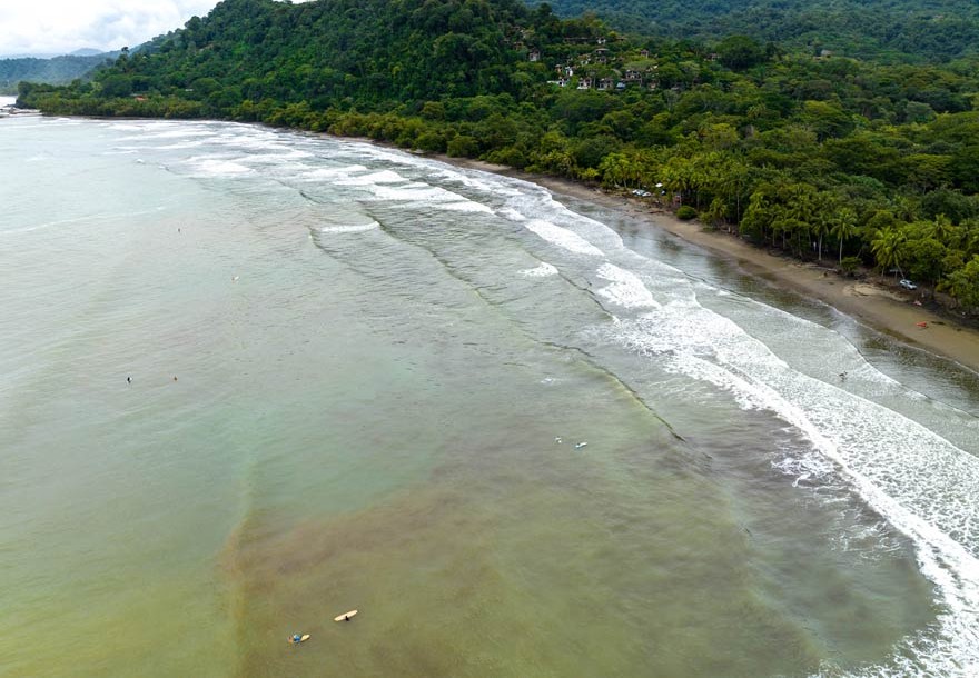 Aerial view of the calm, rolling waves at Playa Dominicalito