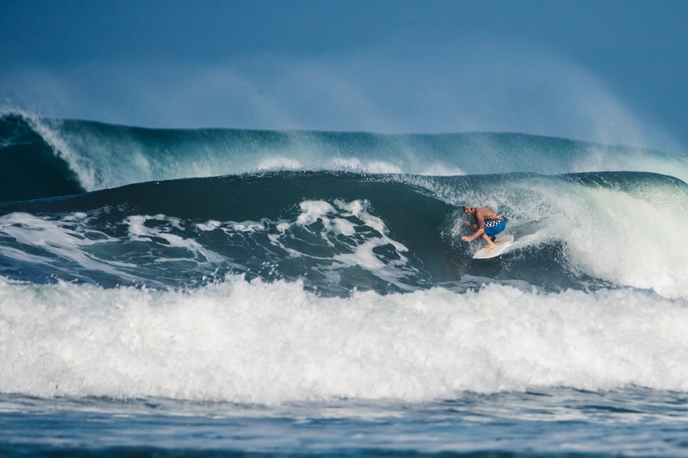 Advanced surfer riding a heavy hollow wave barrel in Mal País near Santa Teresa